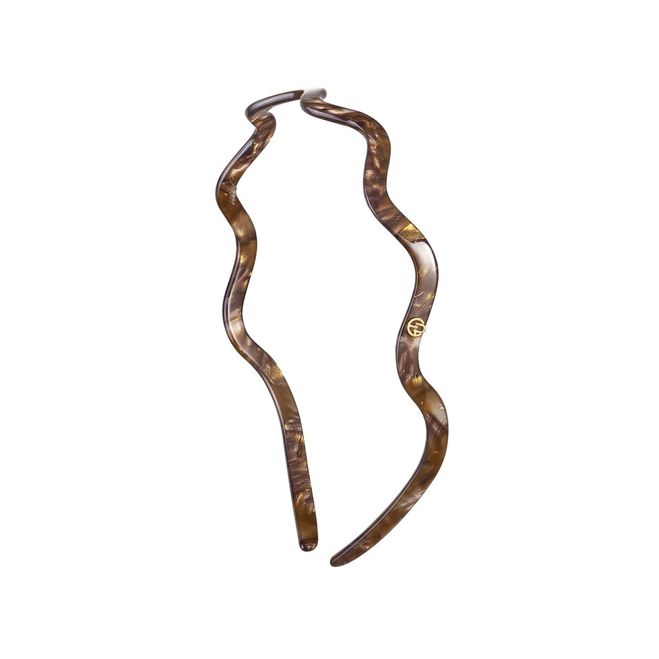 EVITA PERONI wavy glasses headband shows glass-friendly curve for comfortable all-day wear.