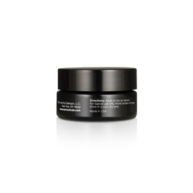 Compact EXO LIPS Hydra Healing Lip Balm packaging displayed on vanity.