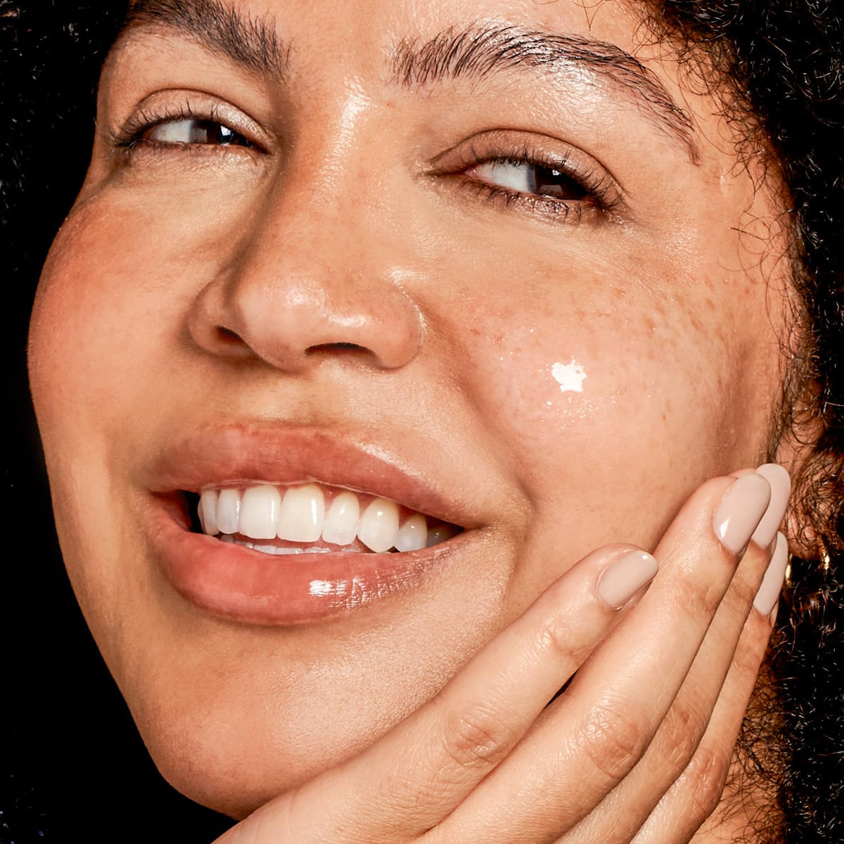 EXUVIANCE Age Reverse layering shot showing serum under moisturizer for a seamless finish