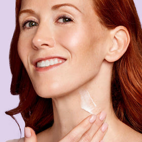 EXUVIANCE Age Reverse neck cream applied to the décolletage area