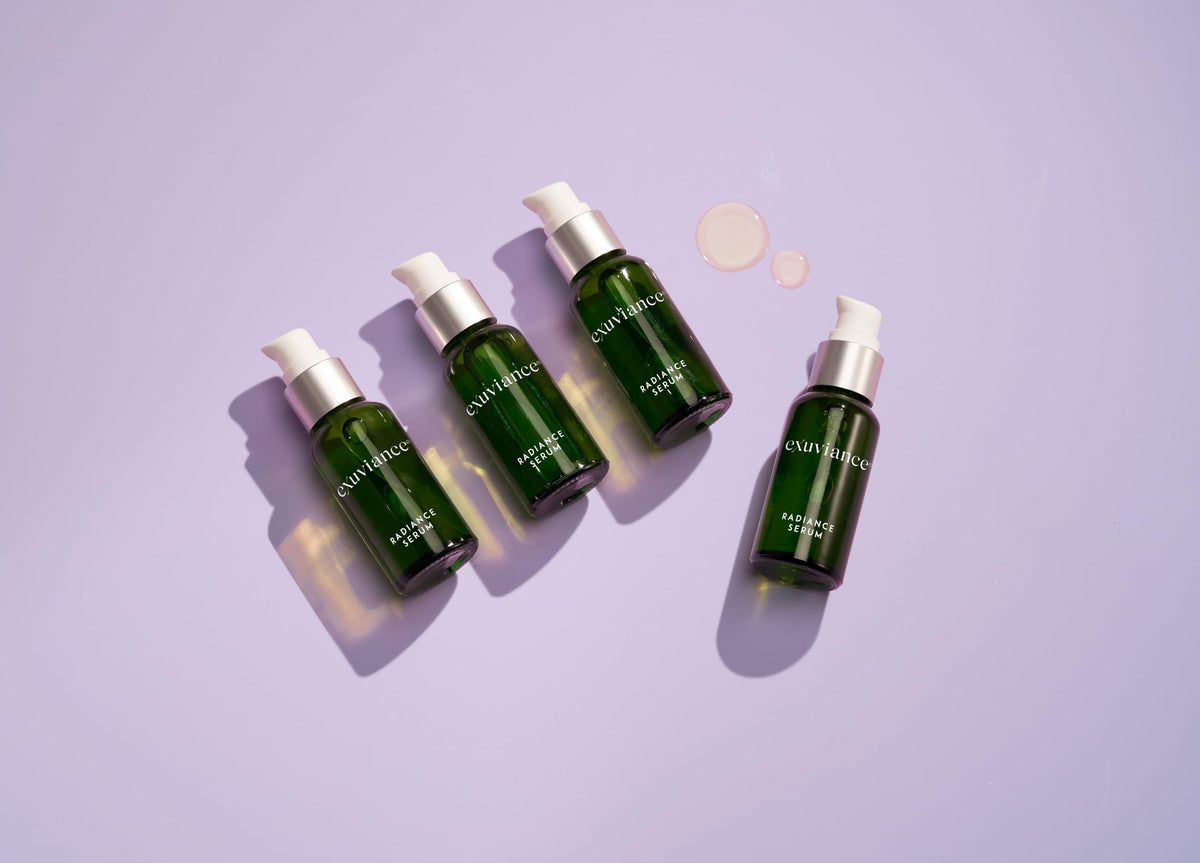 EXUVIANCE Radiance Serum application on face demonstrates easy daily use.