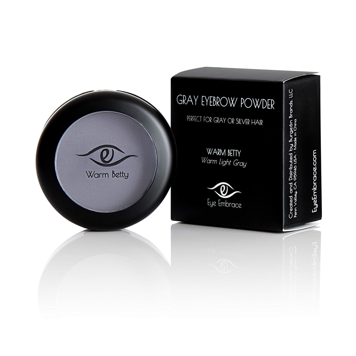 Eye Embrace hair powder being used to cover gray roots along hairline.