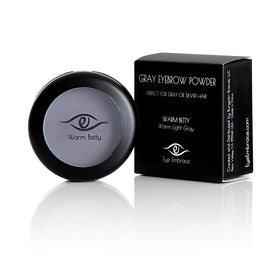 Eye Embrace hair powder being used to cover gray roots along hairline.