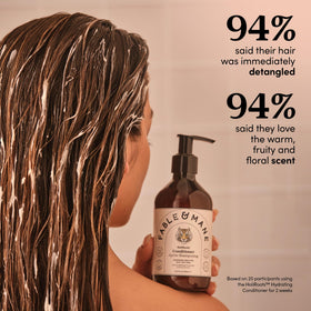 Coconut oil swirl in Fable & Mane conditioner promoting hydration.