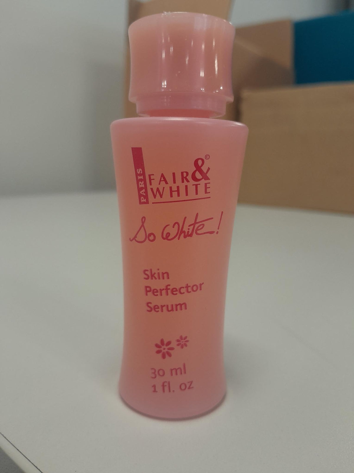 Fair & White So White serum on elbow/knee area suggesting targeted brightening