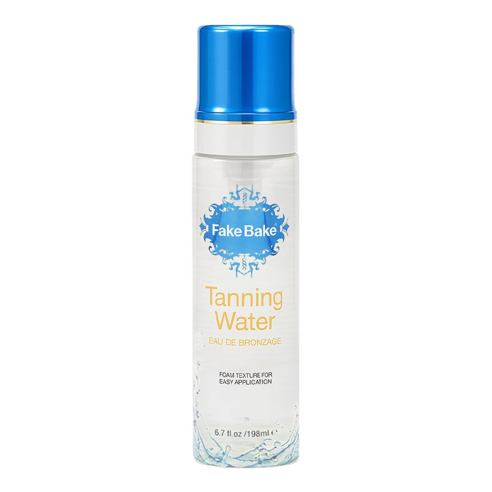 Fake Bake Foam Tanning Water bottle in focus for easy at home sunless tanning.