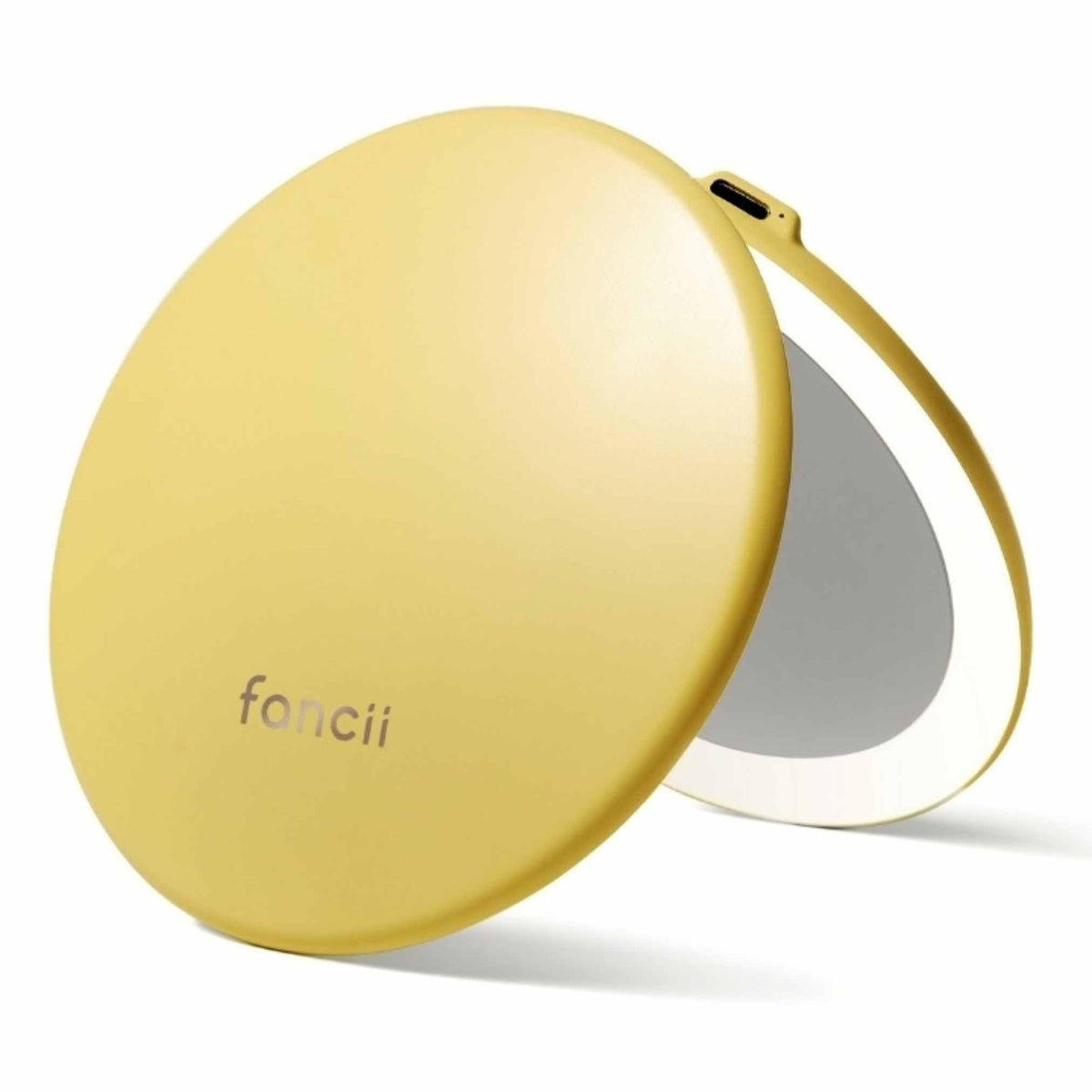 Fancii Taylor travel mirror closed, purse-ready for on-the-go use.