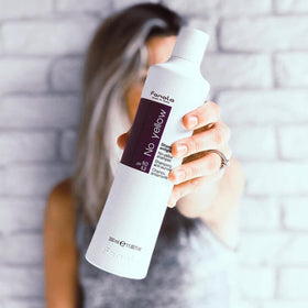 Fanola No Yellow shampoo creates rich purple foam for toning.