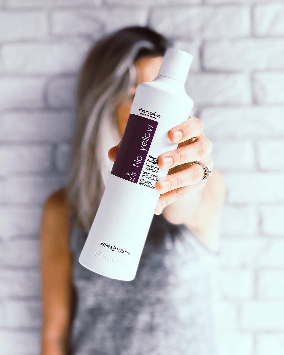 Fanola No Yellow Shampoo neutralizes brassy tones in light blonde hair.