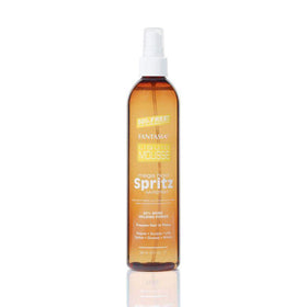 Fantasia Spritz Mega Hold Spray during application for long-lasting hold.