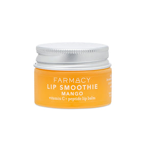 Farmacy lip balm jar close-up highlighting glossy moisture