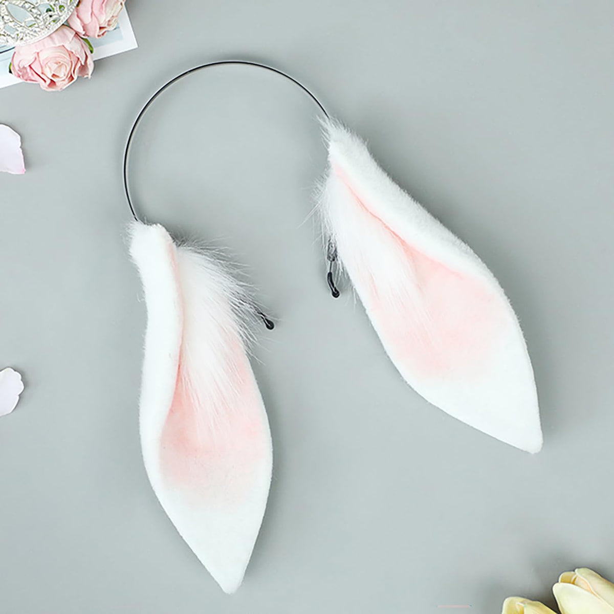 Faylay bunny ears closeup shows soft faux fur texture and realistic shape.