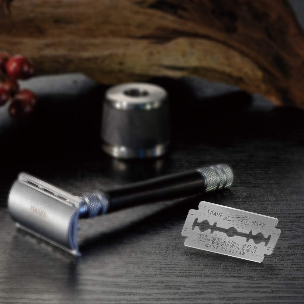 Feather razor blades in use show premium grooming experience.