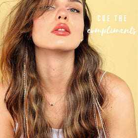 Feather Lily real rooster feathers extensions in earthy shades for subtle volume.