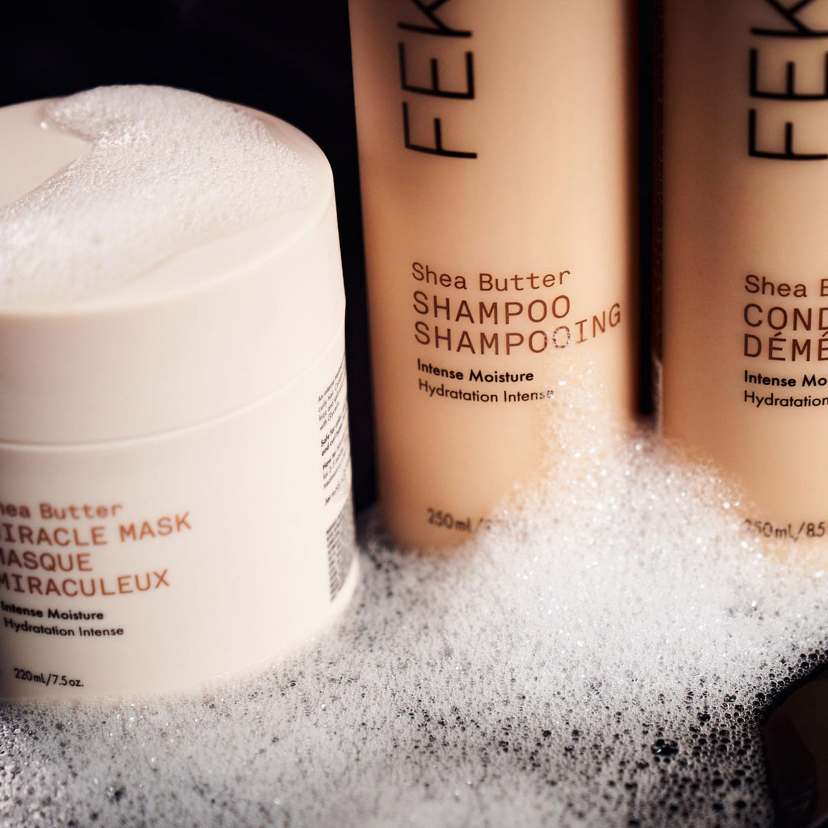 Applying Fekkai Shea Butter Intense Mask to smooth frizz and detangle hair.