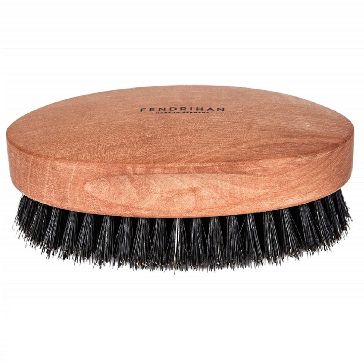 Fendrihan boar bristle brush for gentle scalp massage and oil distribution.
