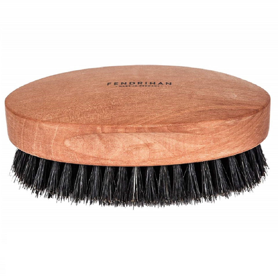 Fendrihan boar bristle brush for gentle scalp massage and oil distribution.