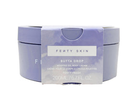 Fenty Beauty Butta Drop packaging with Fenty Fresh scent, refillable hydration.