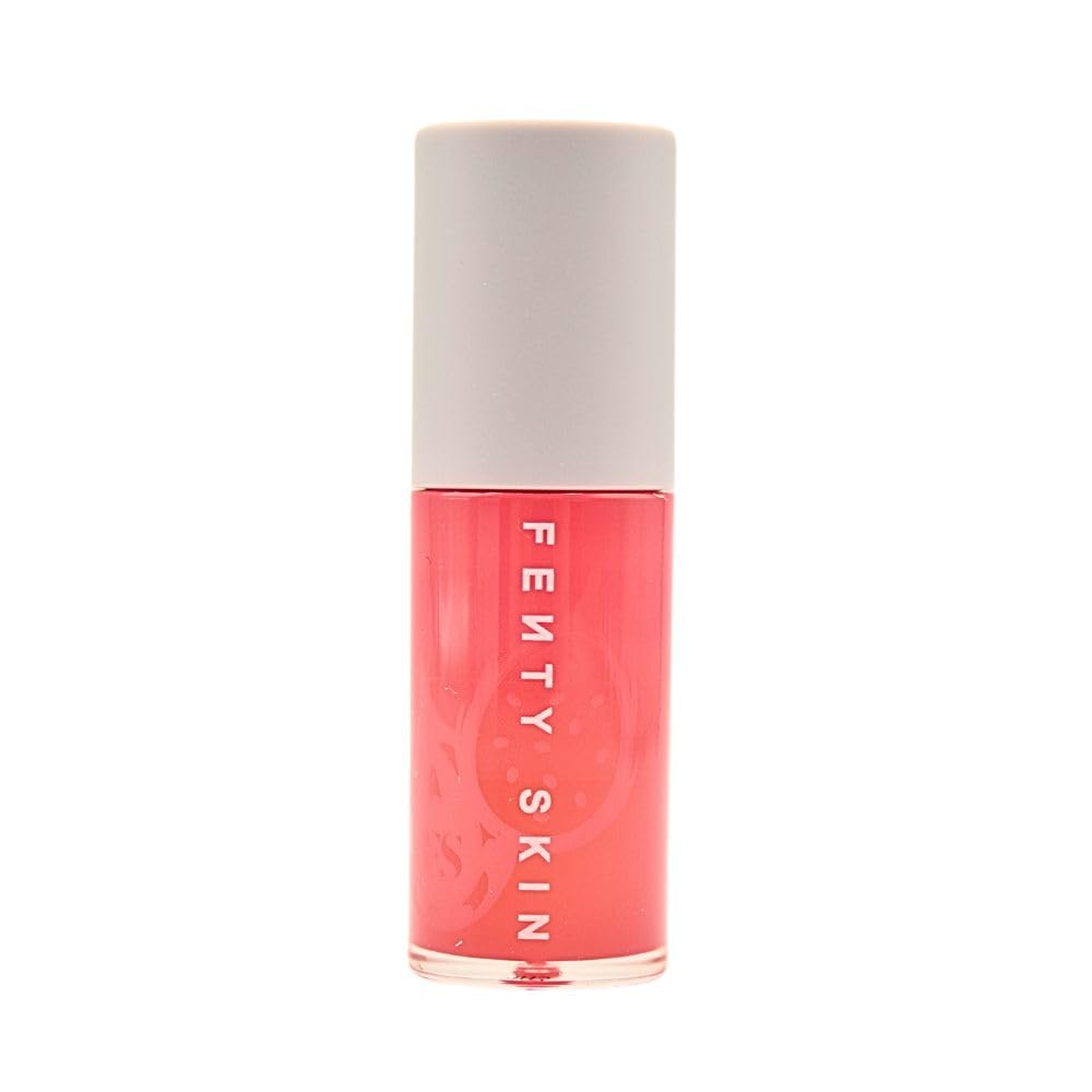 Clear lip oil finish layered over lipstick for added gloss