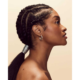 Fenty Hair edge gel packaging shows sleek, travel-friendly design.