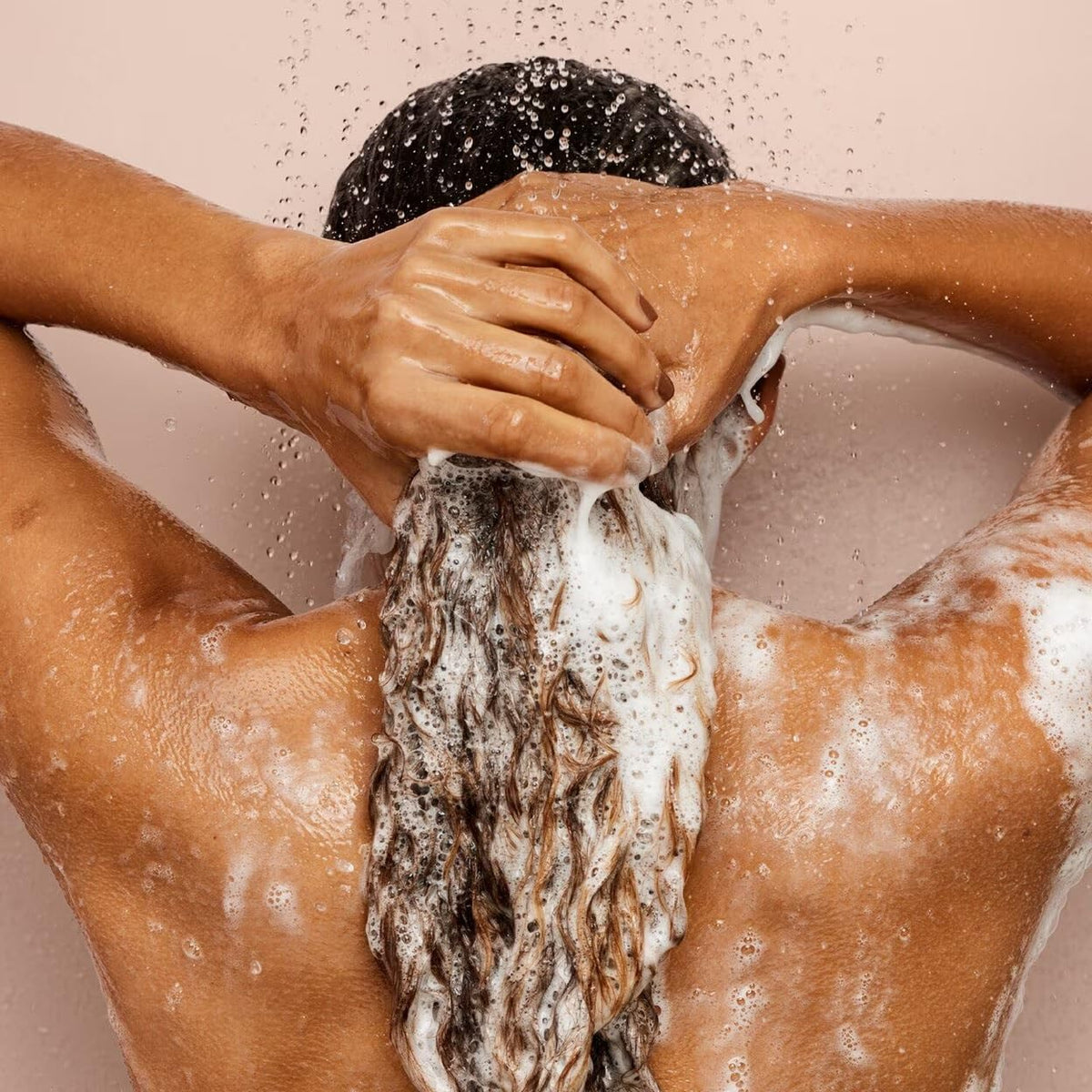 Shiny, color-treated hair after washing with Fenty Hair Rich One Moisture Repair Shampoo.