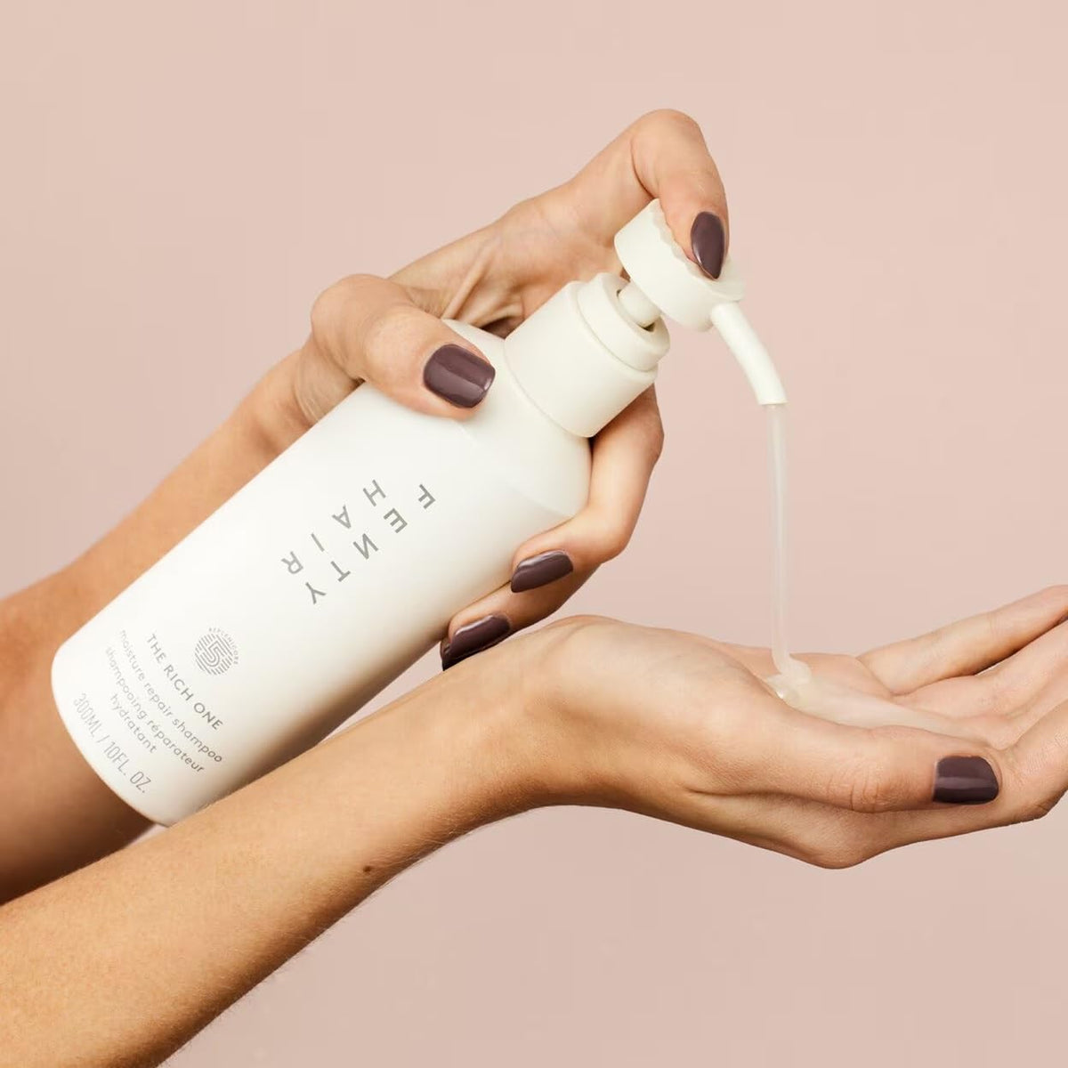 Close-up of rich lather from Fenty Hair Rich One Moisture Repair Shampoo, detangling emphasis.