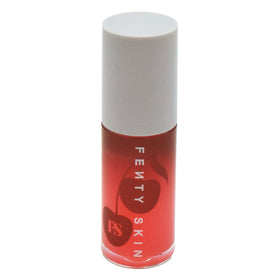 Fenty Skin Cherry Treat lip oil tube showing glossy hydration.