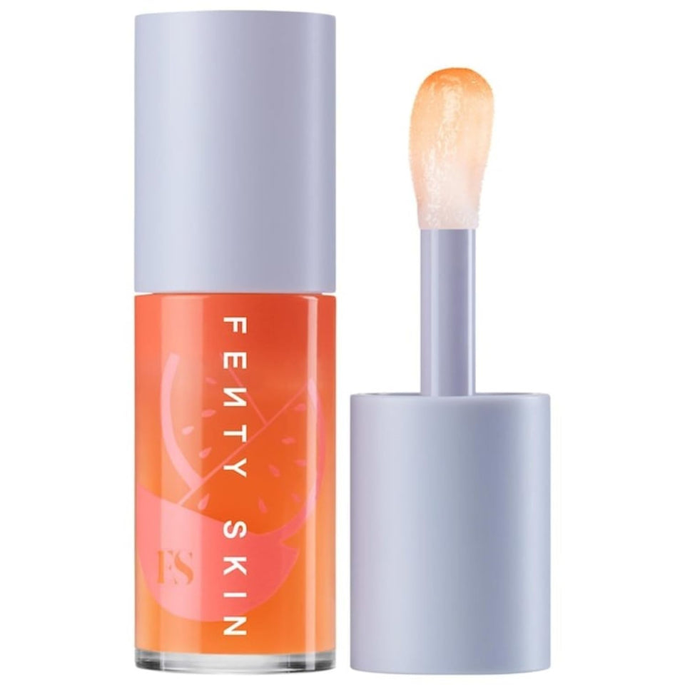Fenty Treatz Lip Oil in Kalahari Melon bottle delivering long-lasting hydration.