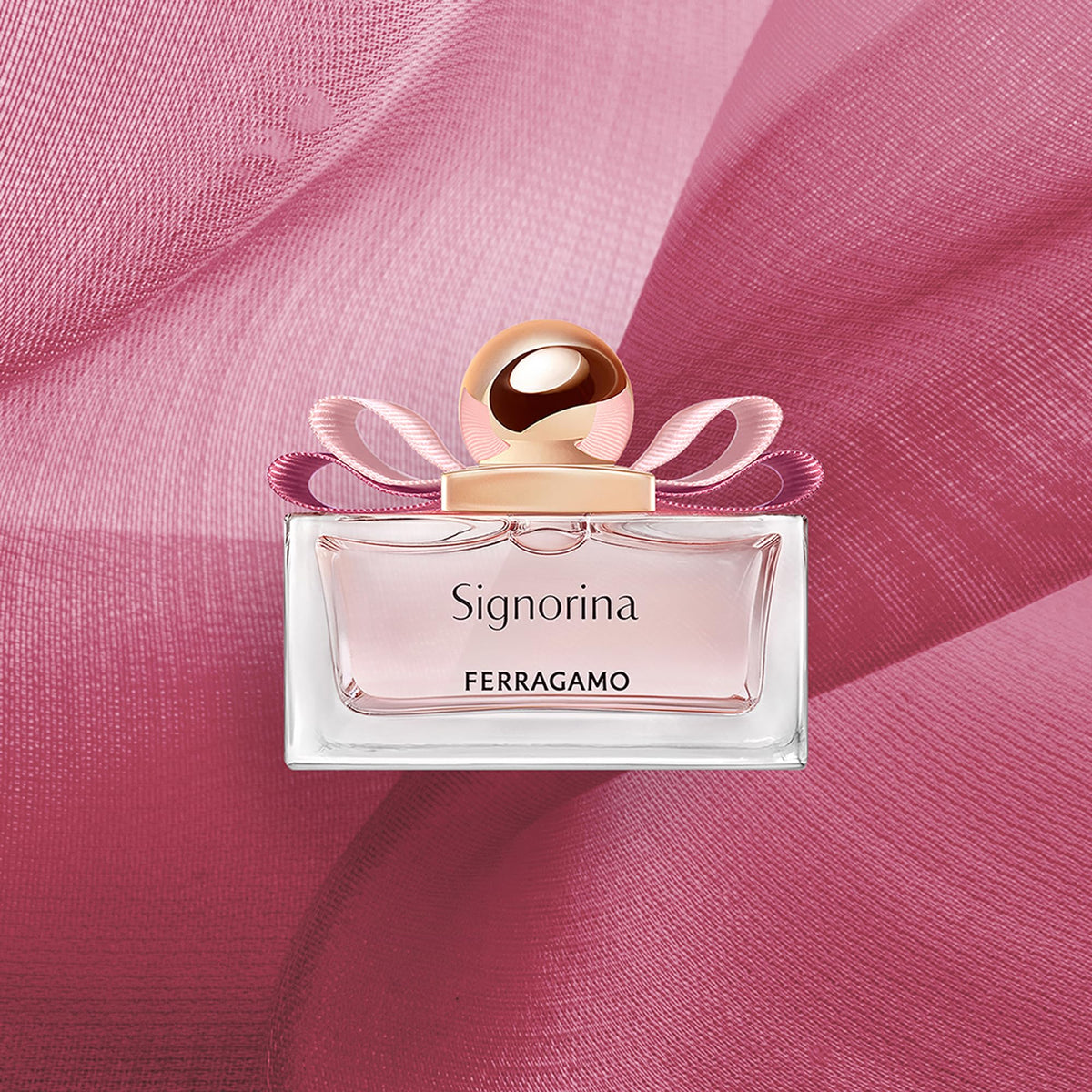 Ferragamo Signorina EDP travel-size bottle on vanity.