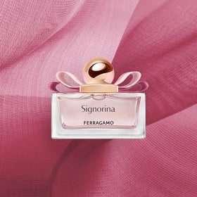 Ferragamo Signorina EDP travel-size bottle on vanity.