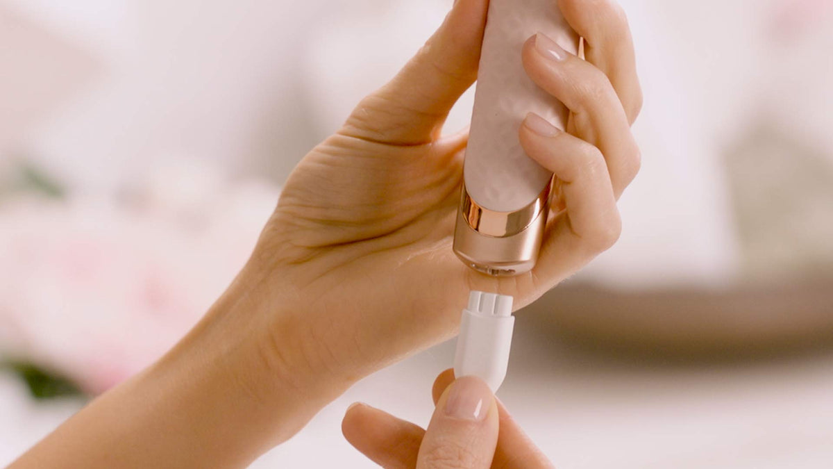 Finishing Touch Flawless Nu Razor USB charging cord included for cordless use.