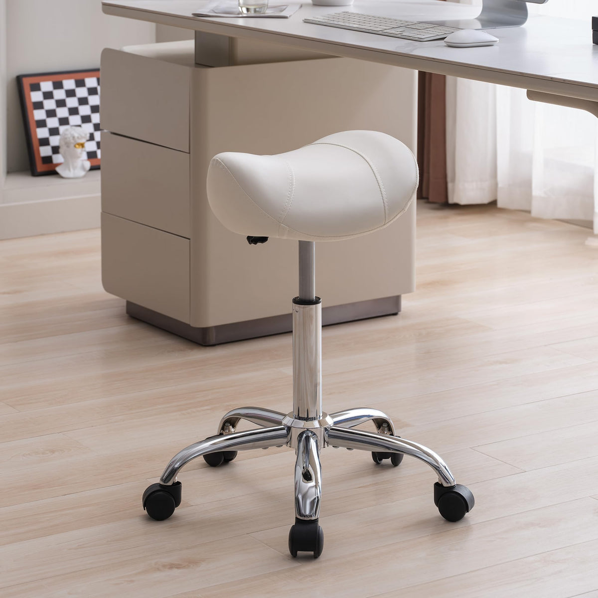 FIRAVOE Saddle Stool with adjustable height for ergonomic comfort during long styling sessions.