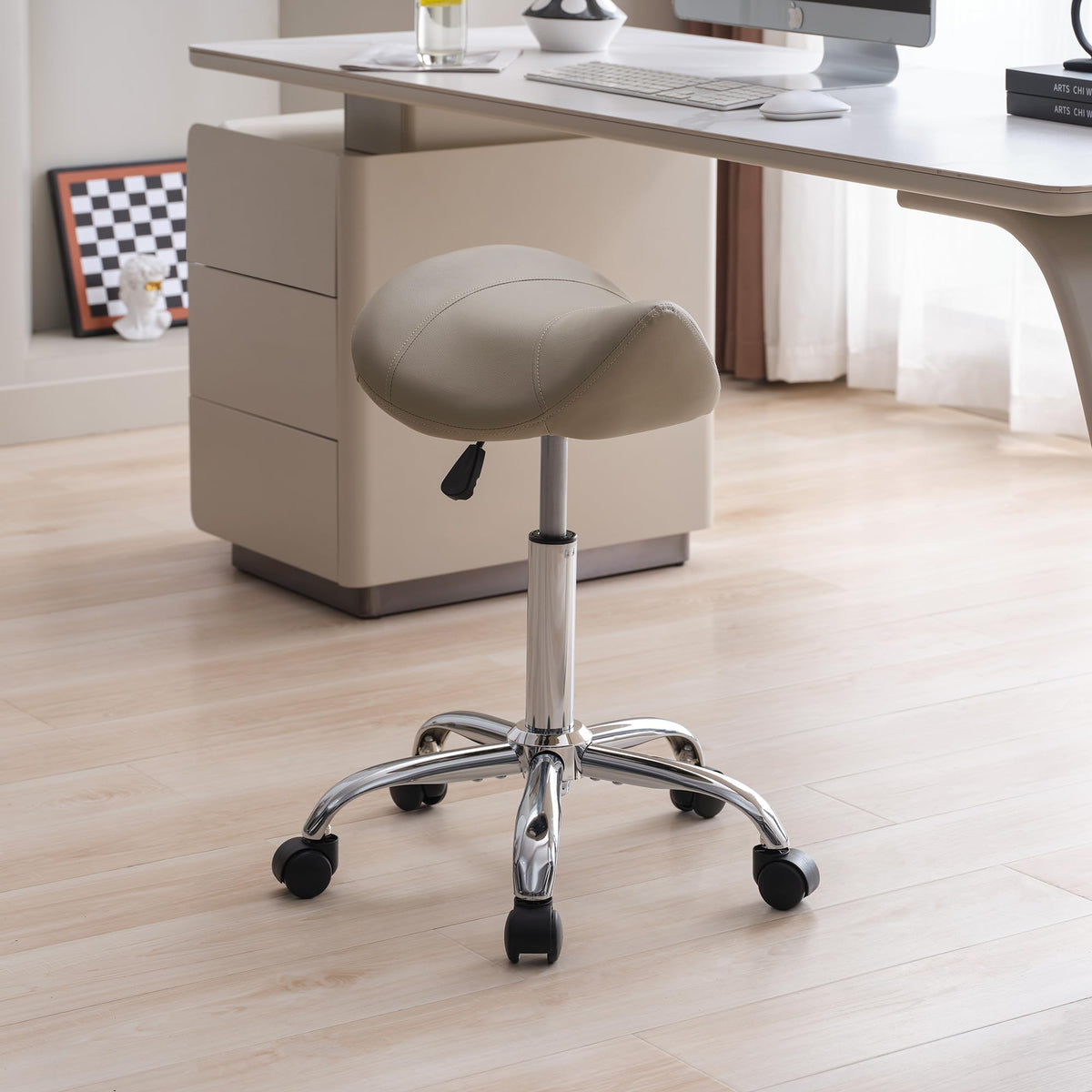 FIRAVOE saddle stool with adjustable height for ergonomic comfort.