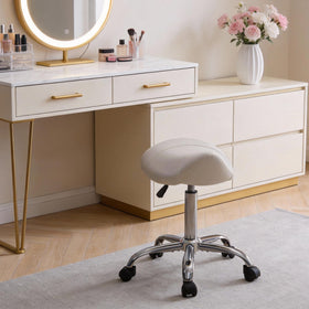FIRAVOE Saddle Stool pairs with salon stations for efficient ergonomics.