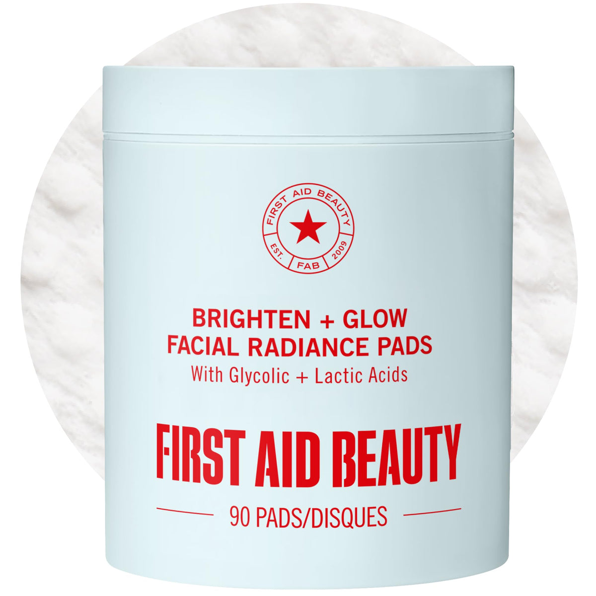 First Aid Beauty Brighten Glow Pad smooth side exfoliates and cleanses the face.