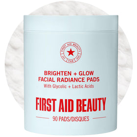 First Aid Beauty Brighten Glow Pad smooth side exfoliates and cleanses the face.