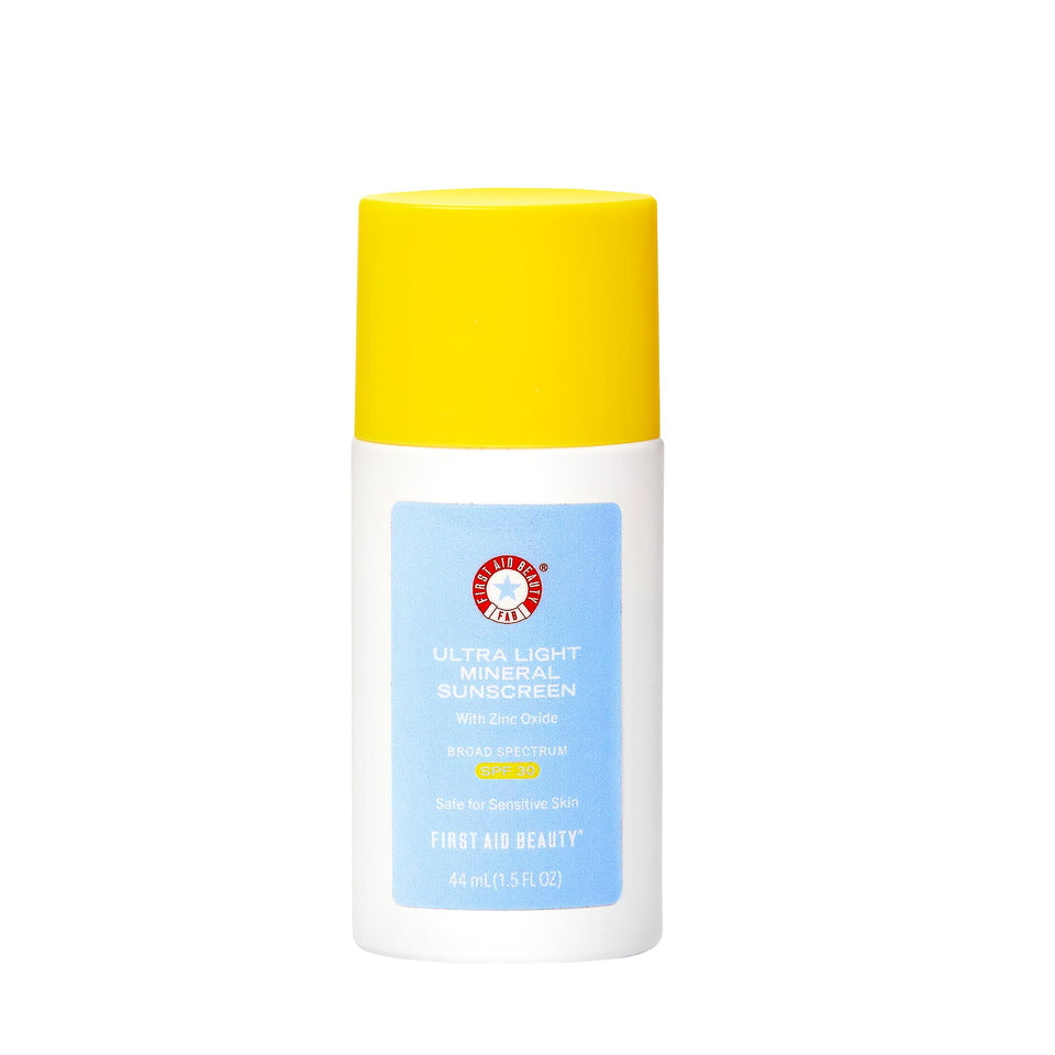 First Aid Beauty weightless sunscreen bottle close-up; sheer tint blends for a natural satin finish.