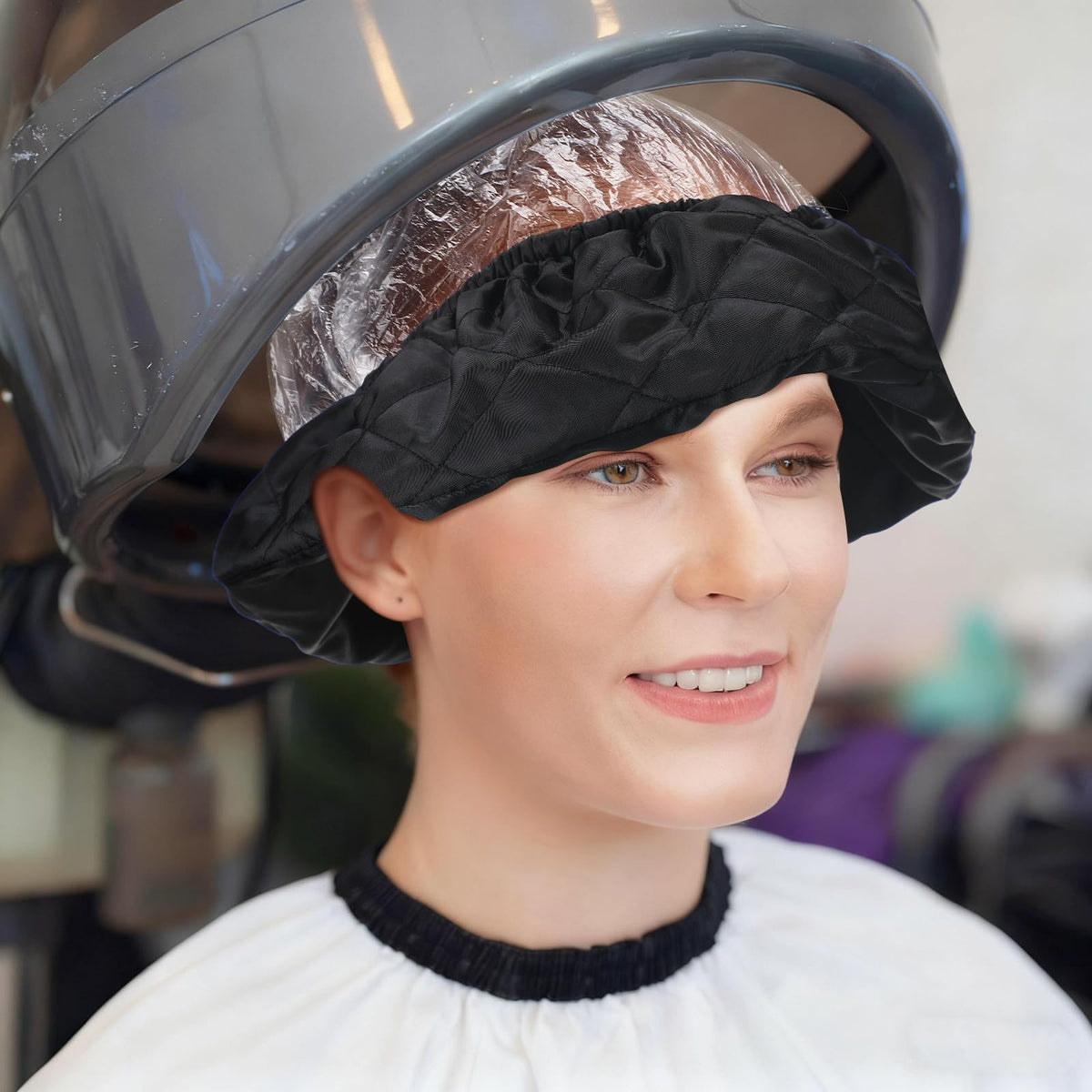 Fiwochic salon setup showing heat shield and disposable hoods for hygiene