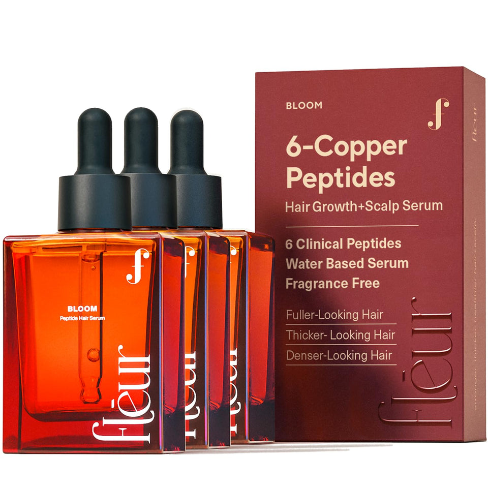 Fléur Bloom serum bottle close-up showing copper peptide formula for hair support