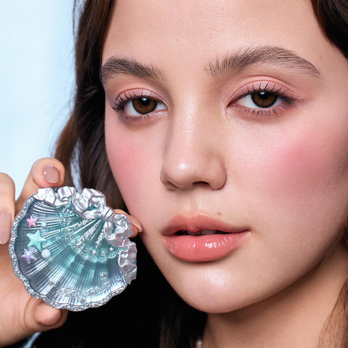 Flower Knows Coral Seashell shade flatters warm skin with peach glow.