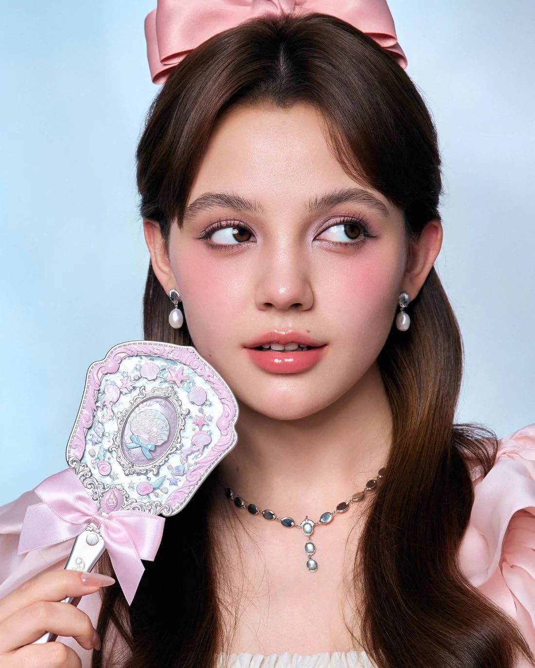 Flower Knows Blush Brush blends powder for a seamless finish.