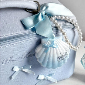 Flower Knows ivory shell compact packaging styled as a chic gift.
