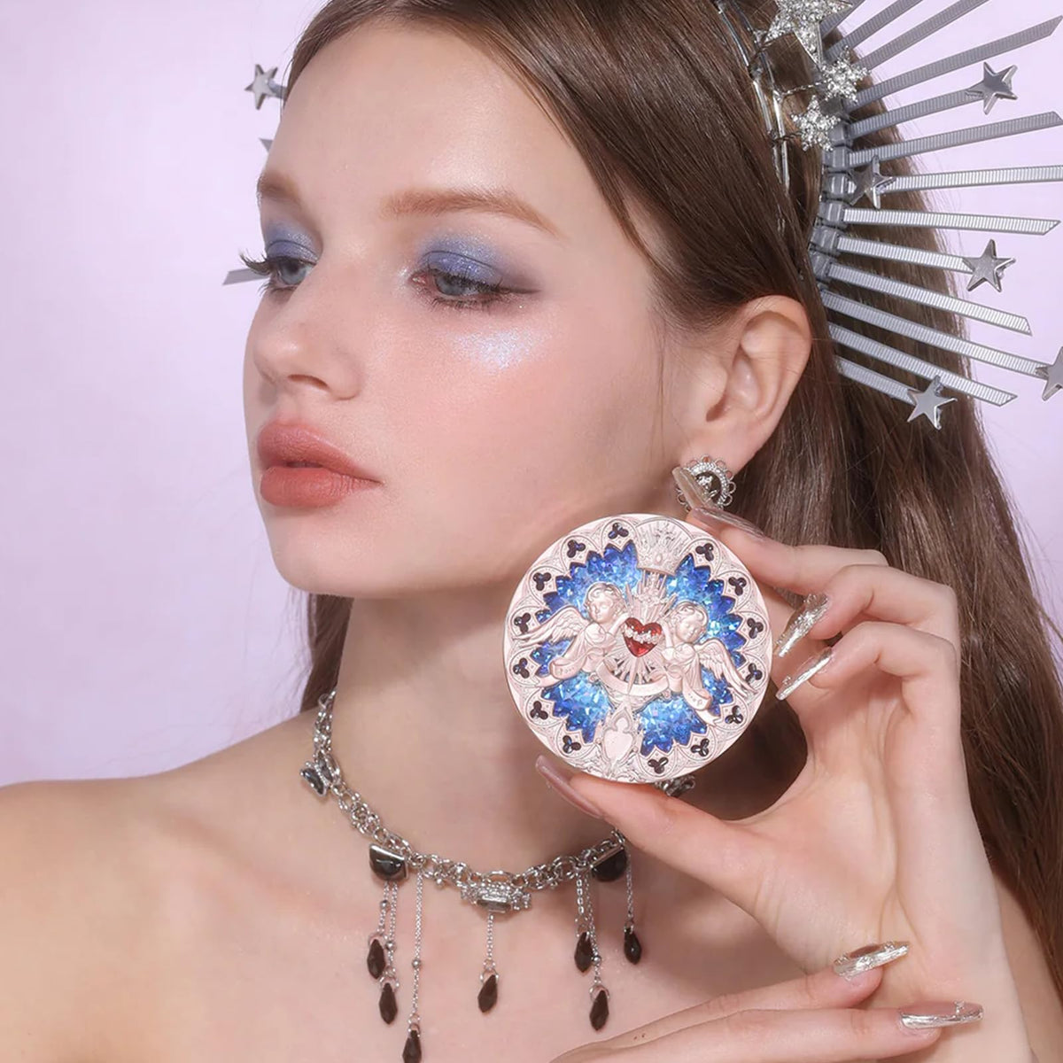 Flower Knows embossed-angel compact adds tactile luxury for precise highlighting