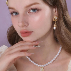 Flower Knows Little Angel Highlighter on the nose bridge adds dewy lift