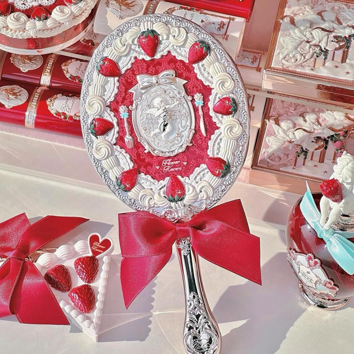 Flower Knows Strawberry Cupid Mirror, gold Cupid detail, adds a luxe accent to dressing.