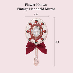 Flower Knows Strawberry Cupid Mirror, long handle, easy grip for precise makeup checks.