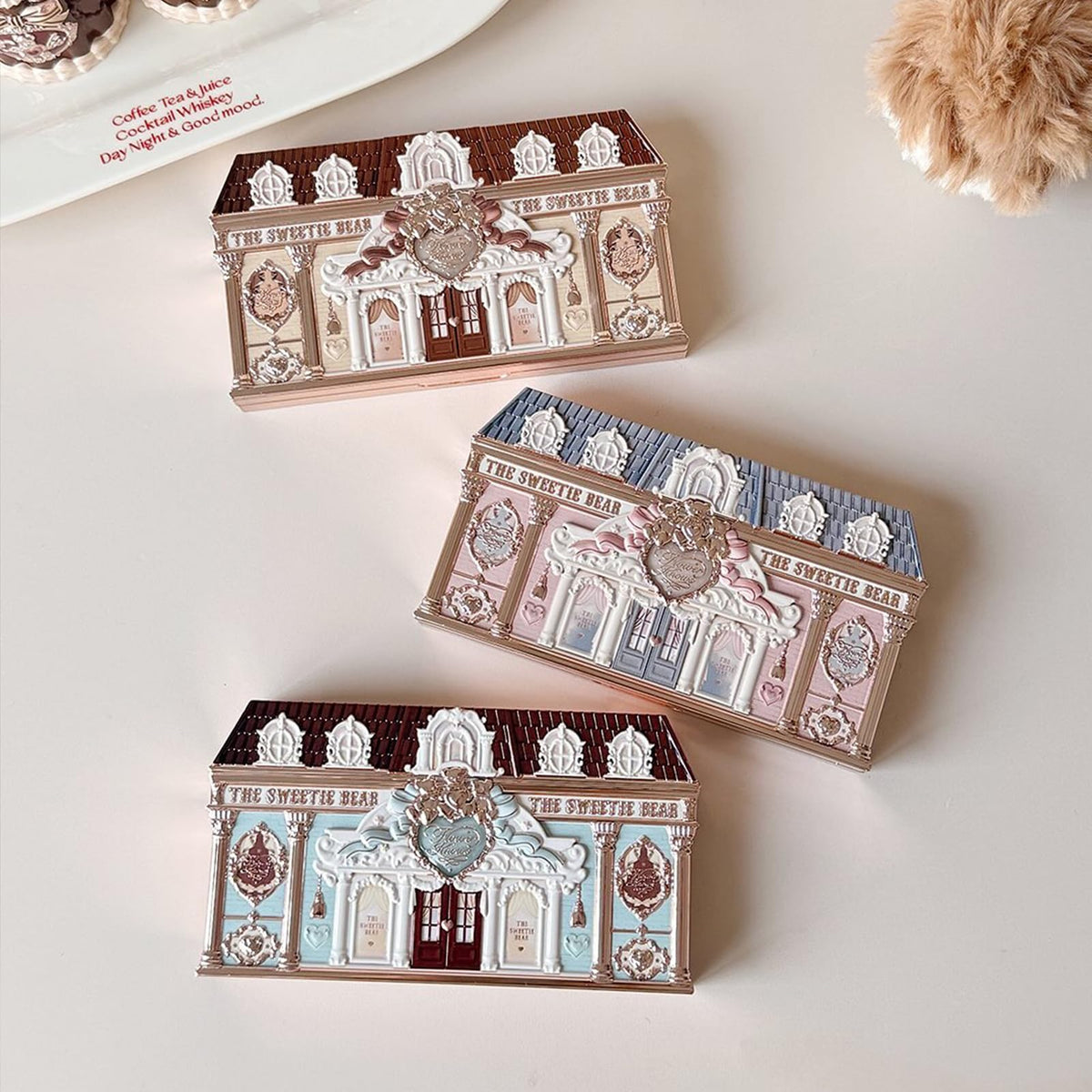 Flower Knows Sweetie Bear lid detail features neoclassical motif.