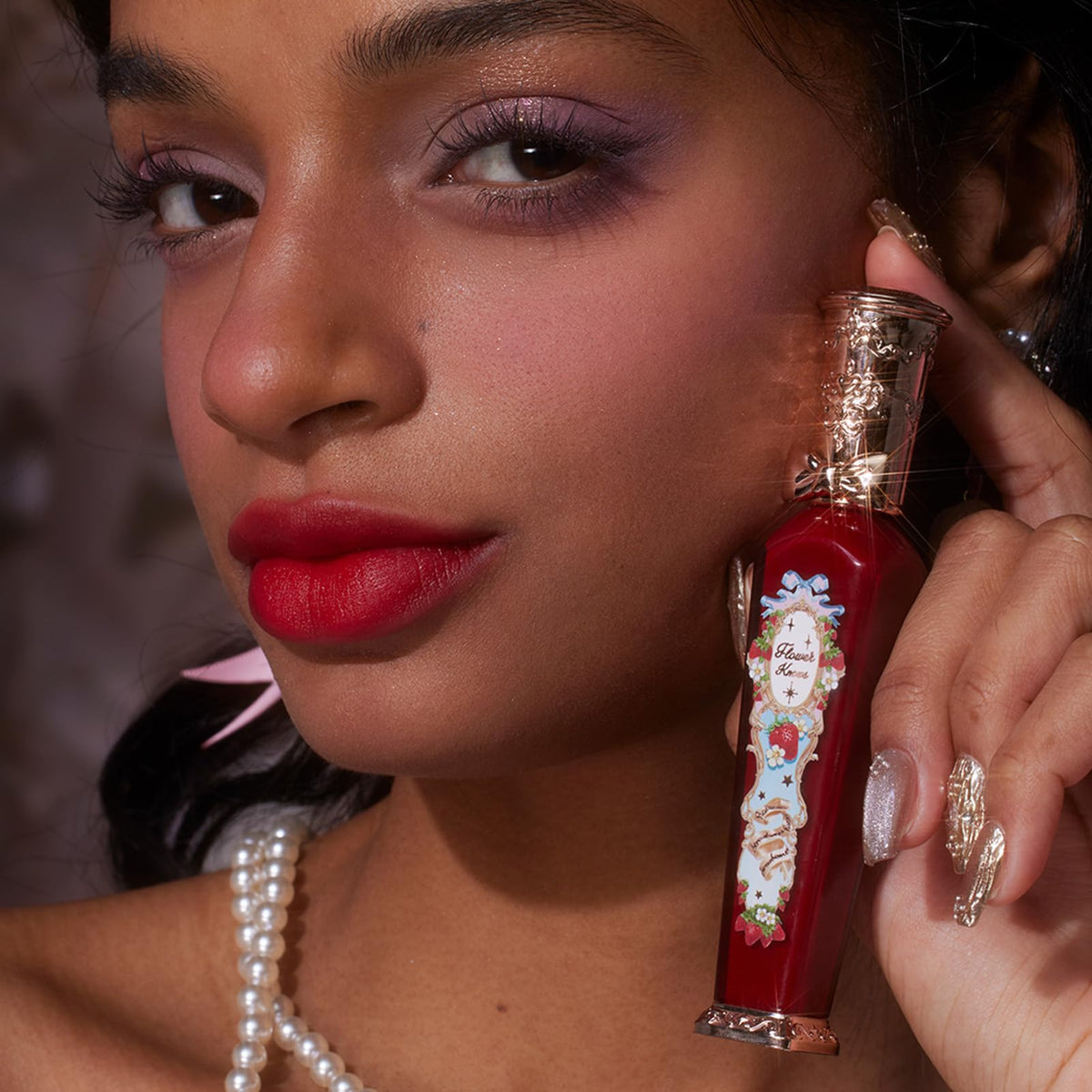 Flower Knows Velvet Redwood on lips reveals transfer-resistant, full-coverage color.