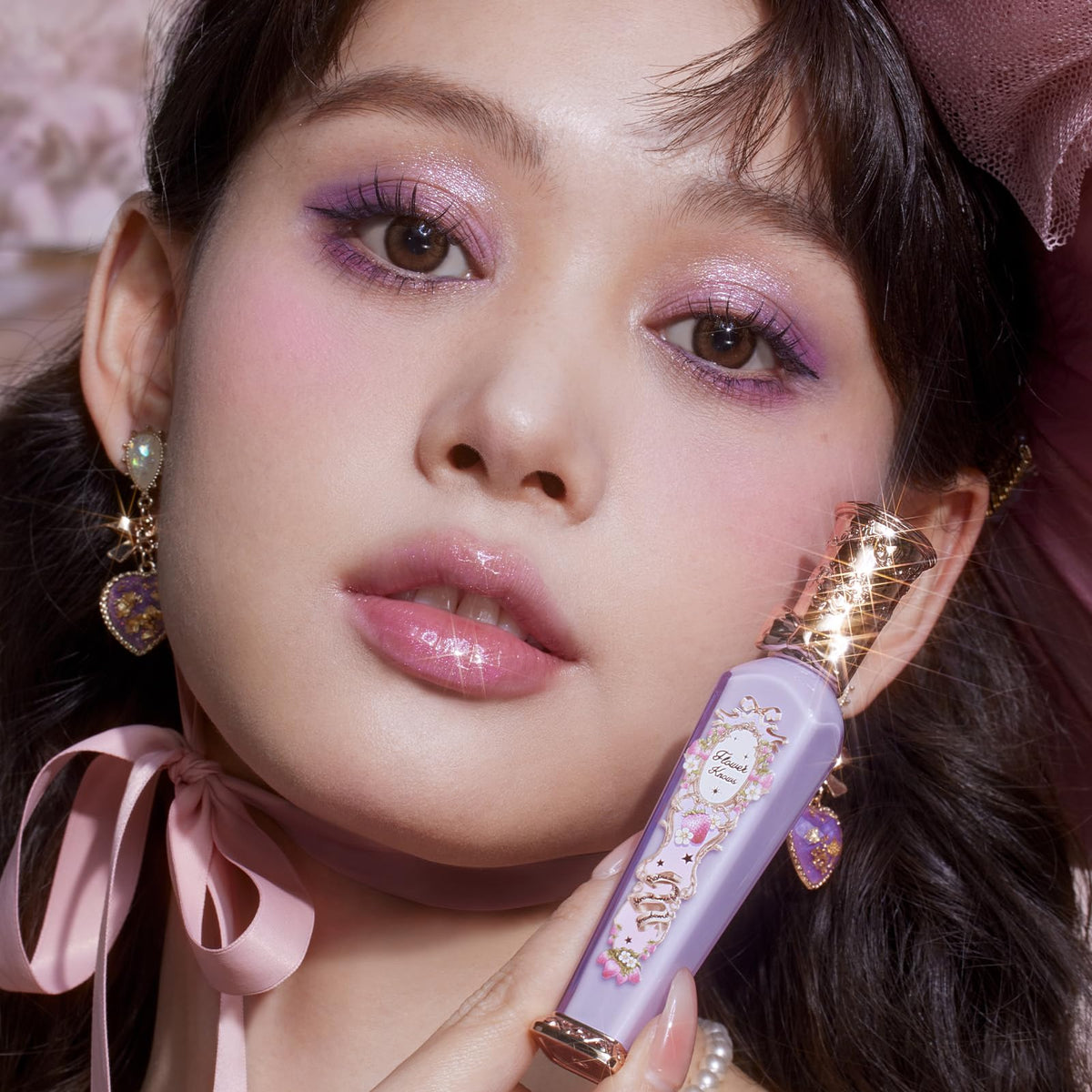 Flower Knows gloss close-up highlighting lilac shimmer details.