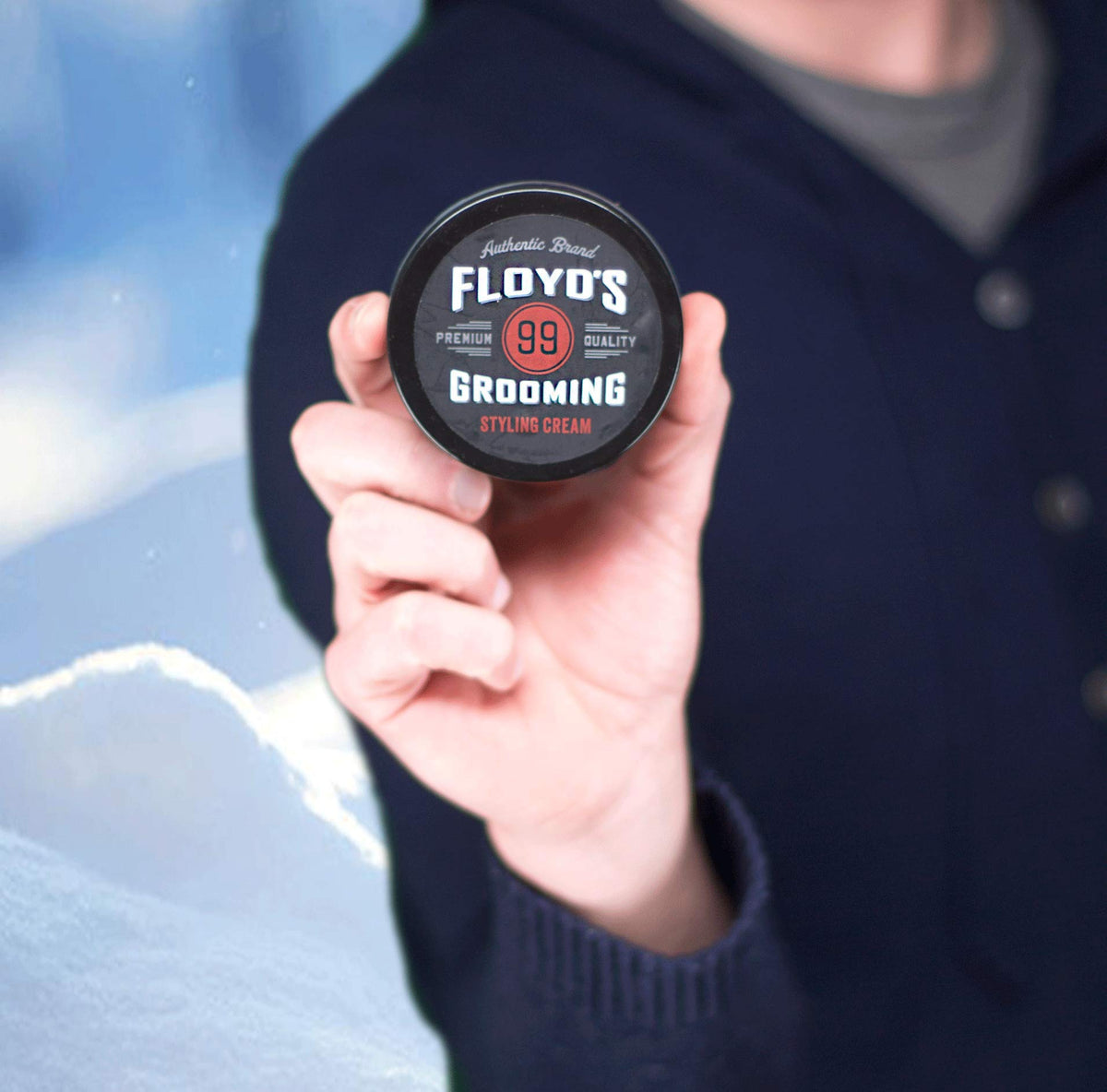 Floyd's 99 Grooming Styling Cream taming frizz on unruly strands for a smoother look.